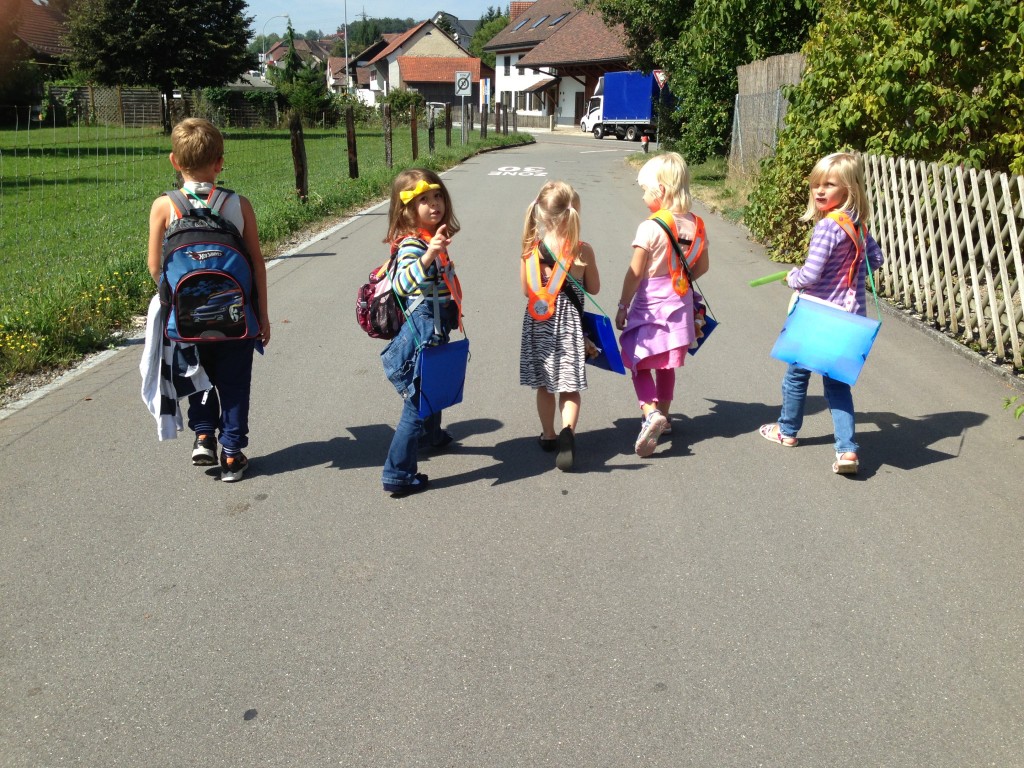 In this picture you have Kindergarten students walking together towards the main road. 